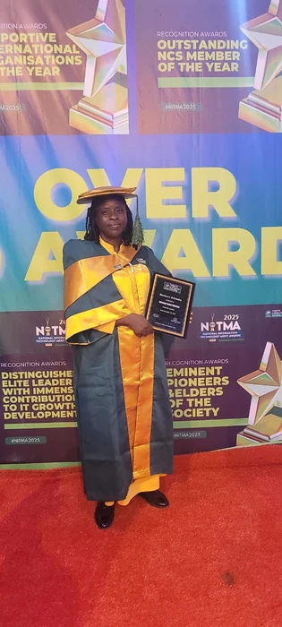 Esther Oduntan at a professional recognition event